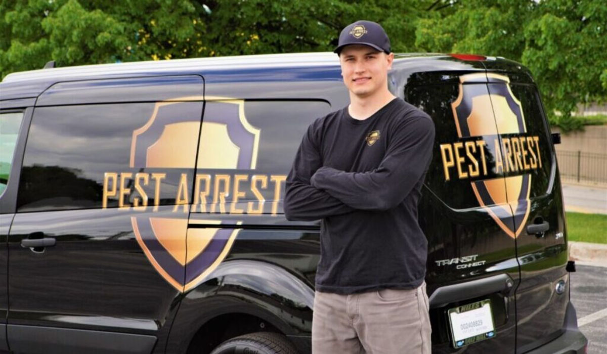 Pest Arrest truck behind a pest control professional